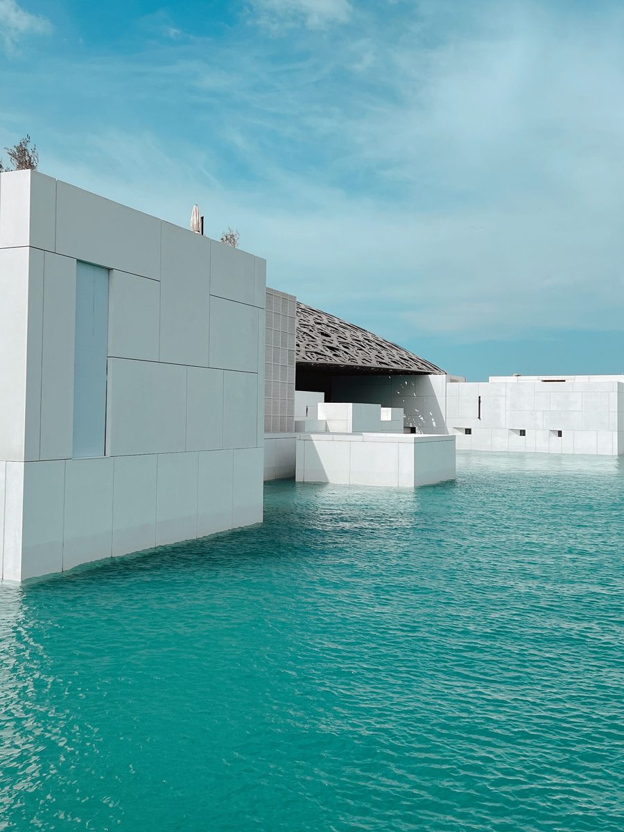 Louvre Abu Dhabi architecture and turquoise water on Saadiyat Island
