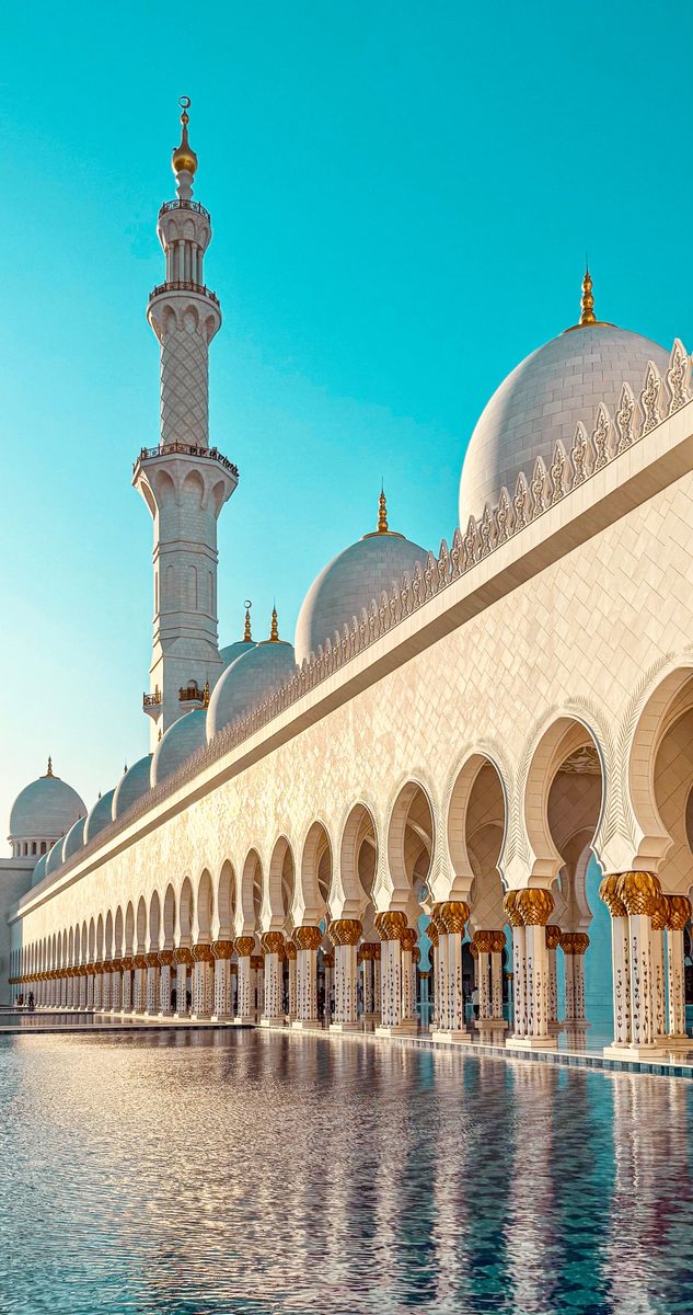 Sheikh Zayed Grand Mosque in Abu Dhabi with reflected arches and minaret